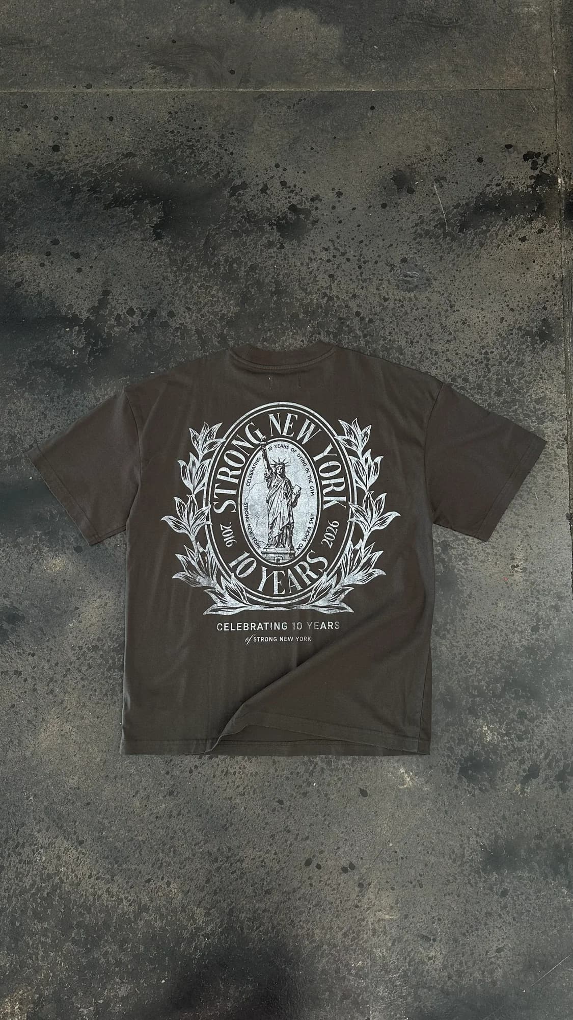 Dark Strong New York anniversary tee with a white illustrated crest